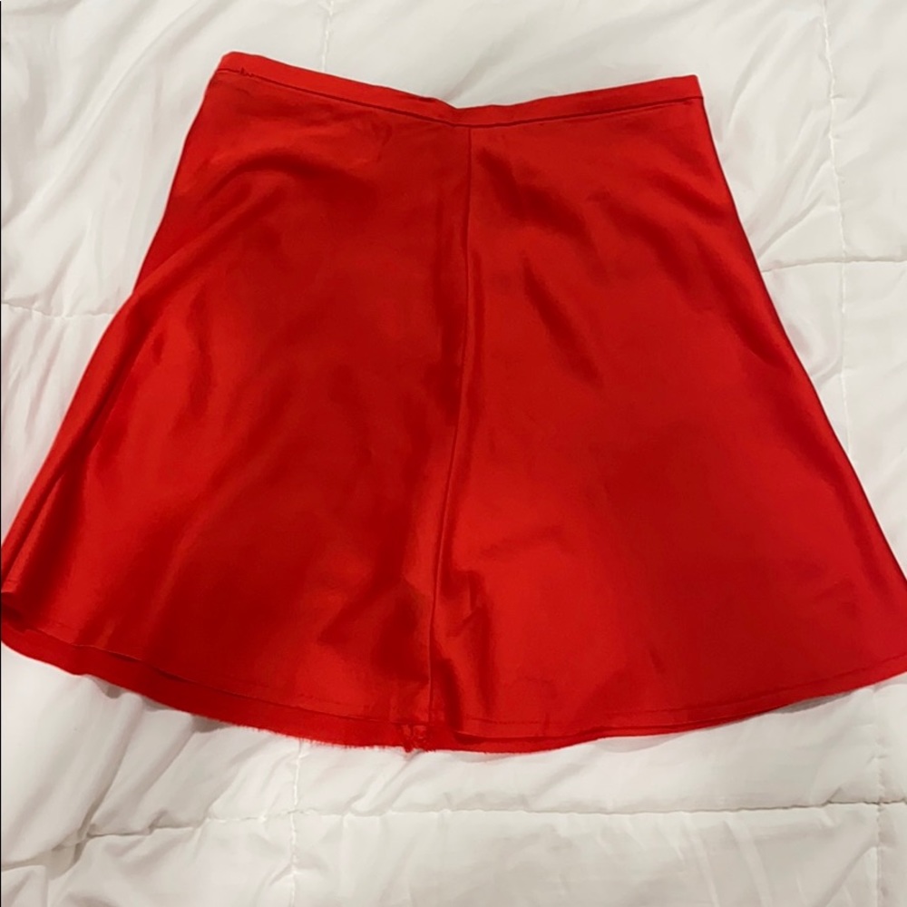 red silky skirt